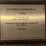 A plaque with the words outstanding leadership service.