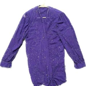 A purple blouse with sequins on it.