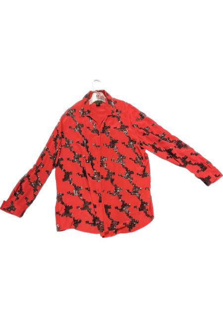 A red shirt with black and white flowers on it.