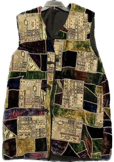 A multi colored patchwork vest on a mannequin.