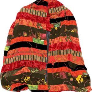 A red, orange, and black Designer Garment 25 quilted blanket.