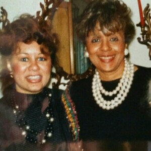 Three older women posing for a photo.