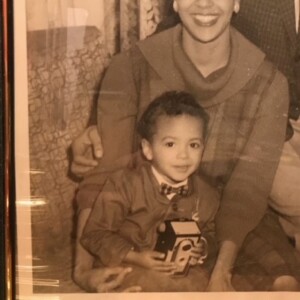 A black and white photo of a woman and her son.