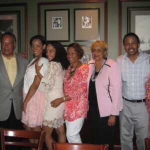 A group of people posing for a picture in a restaurant.
