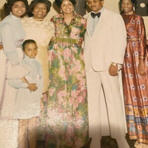 An old photo of a family posing for a picture.