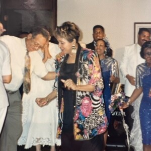 A group of people dancing at a party.