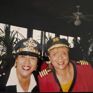 Two women in uniform posing for a photo.