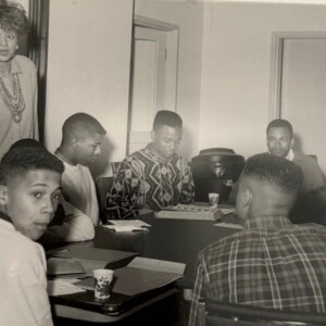 A group of people sitting around a table.