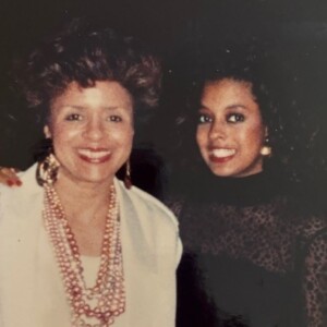 A photo of two women posing for a picture.