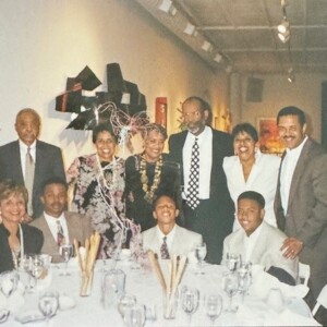 A group of people posing for a picture at a table.