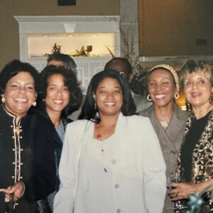 A group of people posing for a picture at a party.