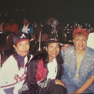 A group of women posing for a photo at an event.
