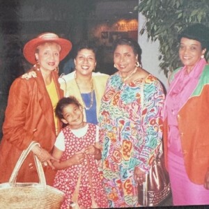 A photo of a group of women posing for a picture.