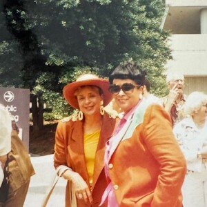 Two women standing next to each other at an event.