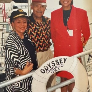 Three people posing for a photo on a boat.