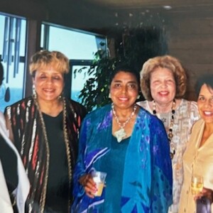 A group of women posing for a picture at a party.