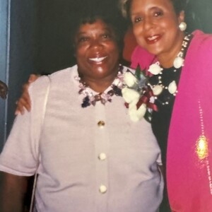 Two women posing for a photo with each other.