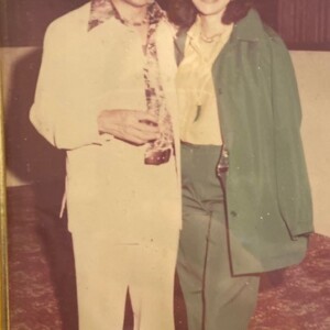 A man and woman posing for a picture.