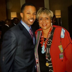 A man and woman posing for a photo at an event.
