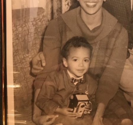 A black and white photo of a woman and her son.